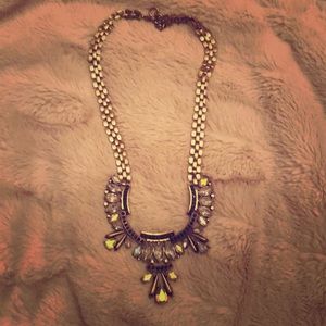 Gold tone collar necklace with clear stones.